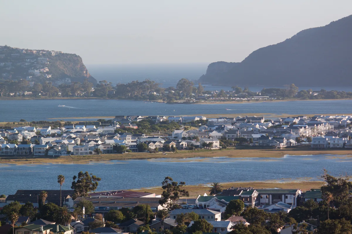 Aerial view across Knysna Lagoon with Thesen Islands mid-frame and the Heads beyond