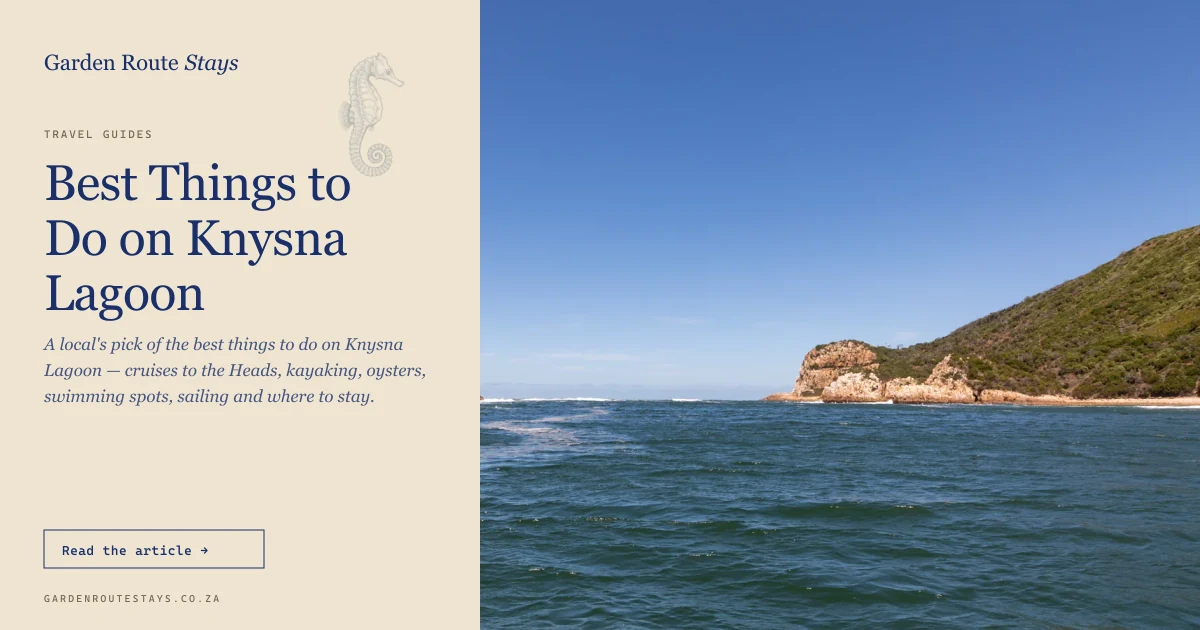 The Knysna Heads from the water — two sandstone cliffs framing the channel where Knysna Lagoon meets the Indian Ocean
