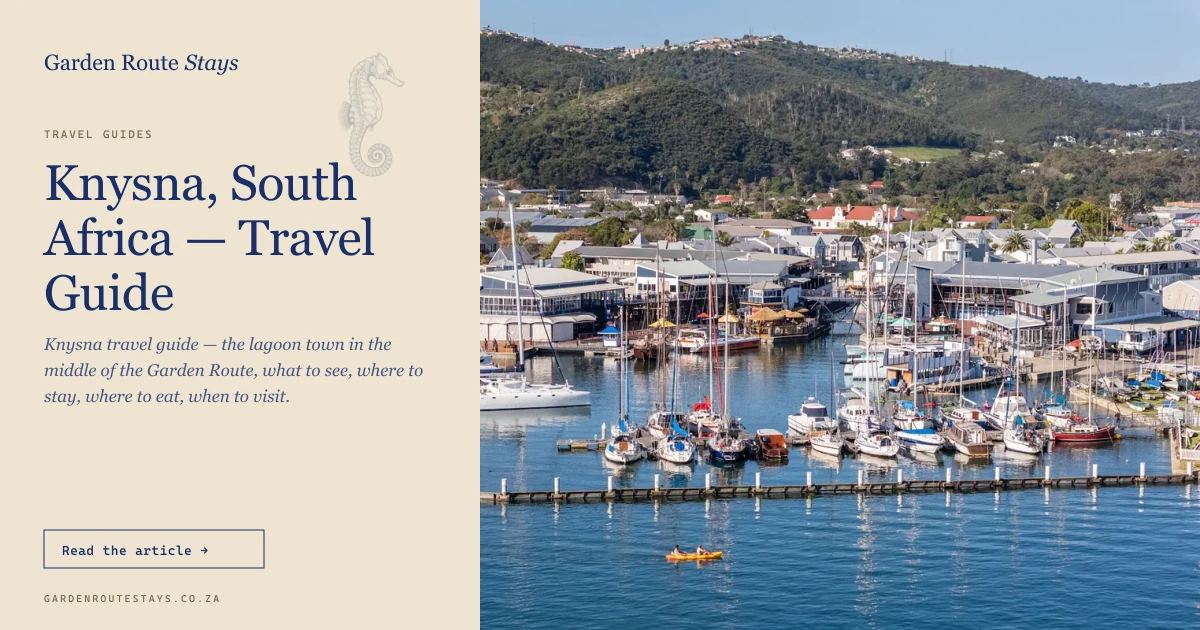 Aerial of Knysna Waterfront marina with the town and forested hills behind, Western Cape