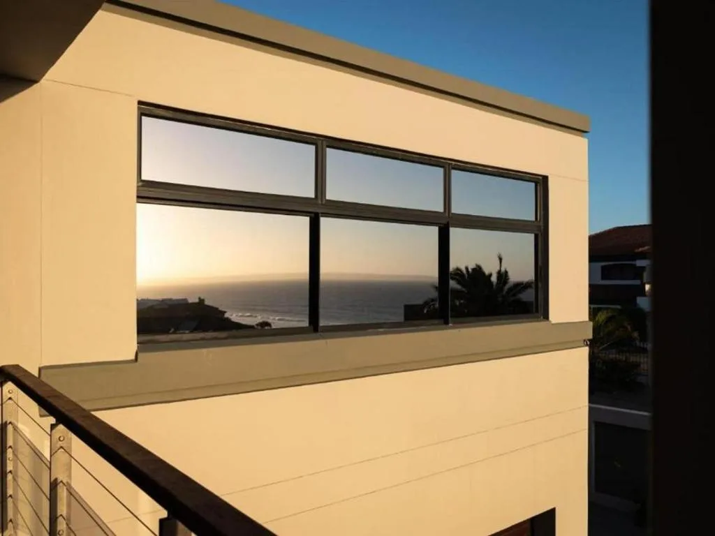 Seascape vista with coastline and ocean visible through large windows