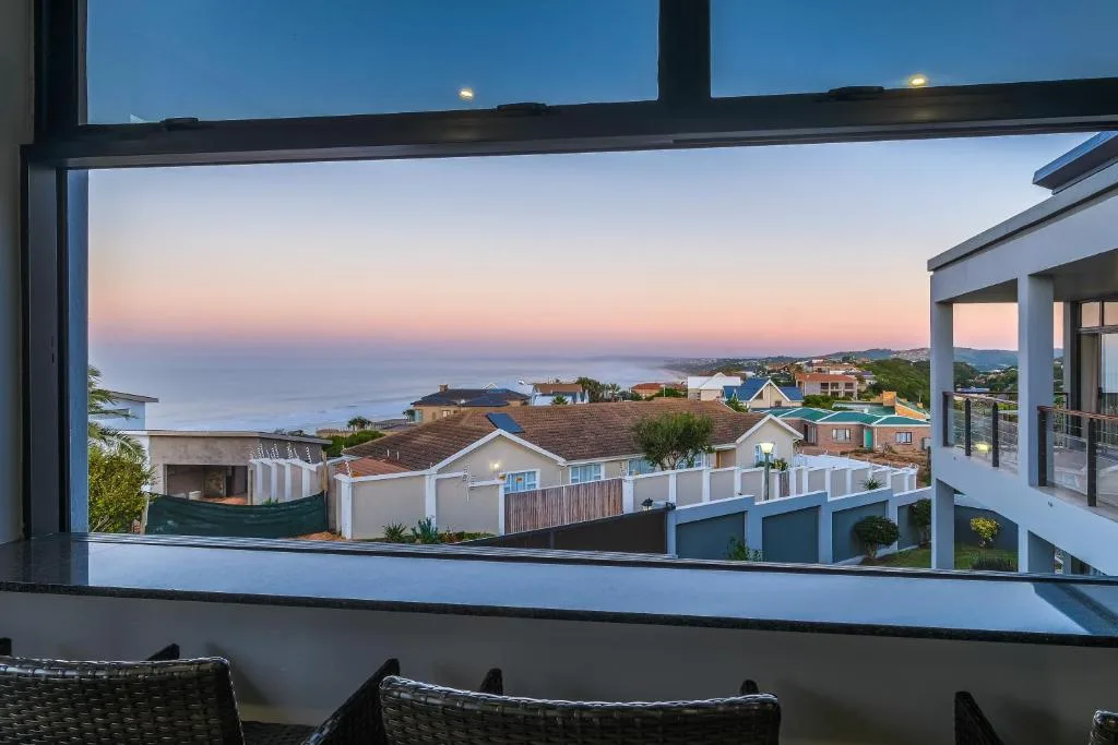 Sunset view over Great Brak River town and coastline from modern deck