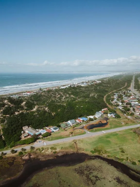 Aerial view of Great Brak River coastal property with ocean and beach landscape