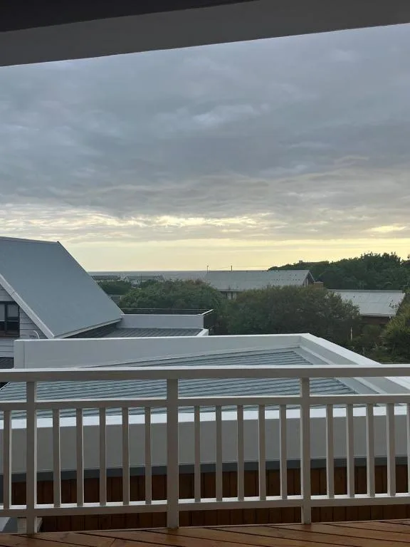 Scenic overlook across valley and countryside from elevated deck railing