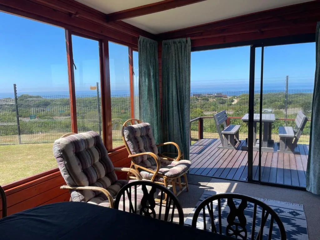 Expansive coastal and lagoon views from bright windows and deck seating area