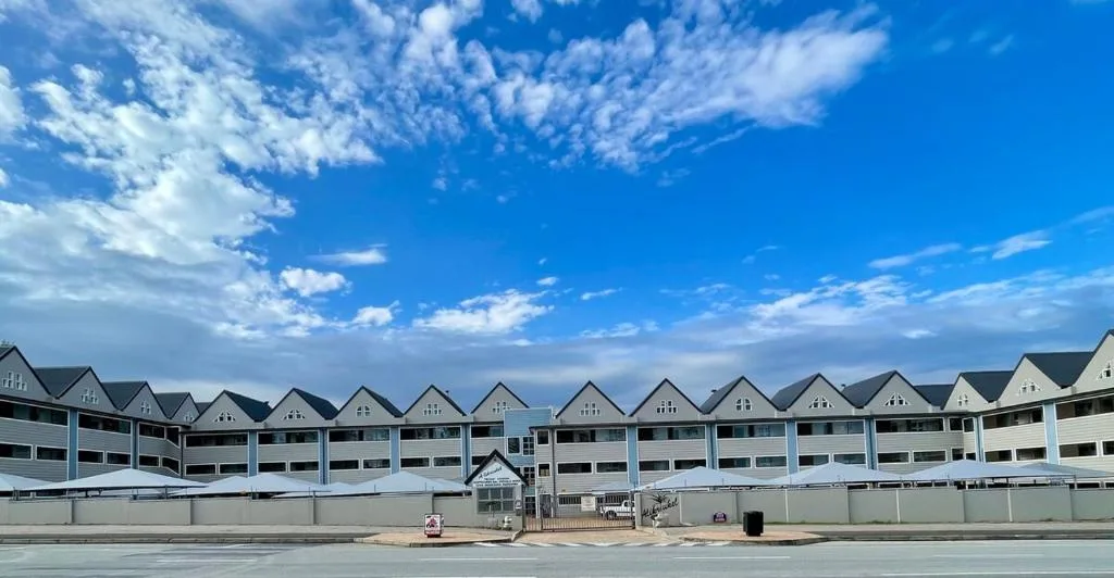 Beachfront apartment complex with multiple units and ocean access gate