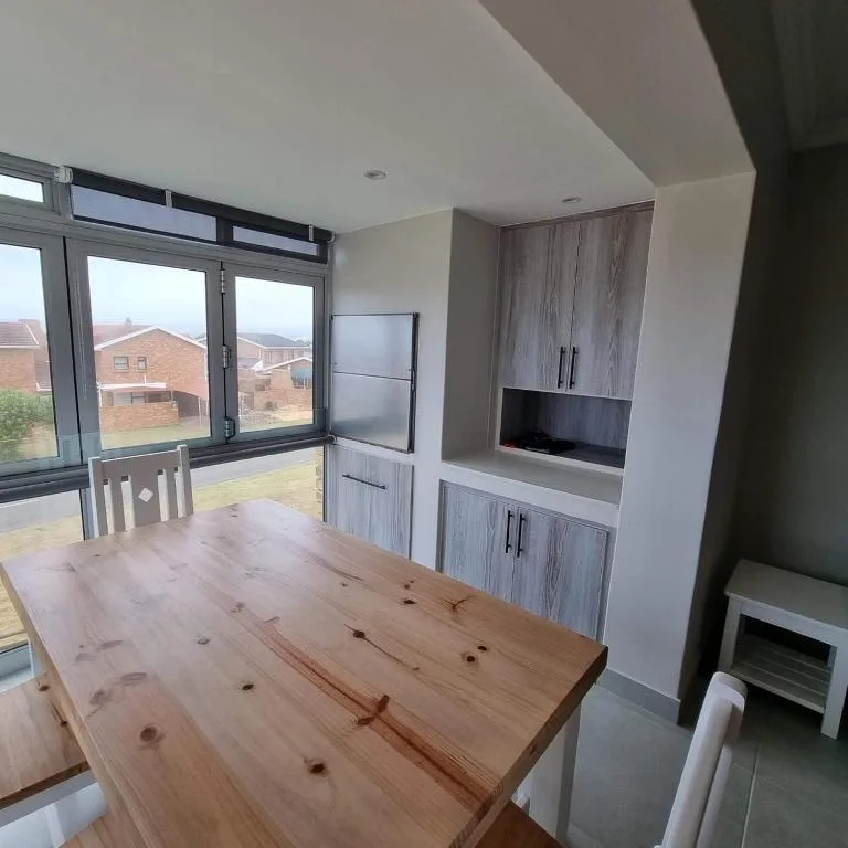 Modern dining room with wooden table and built-in cabinetry