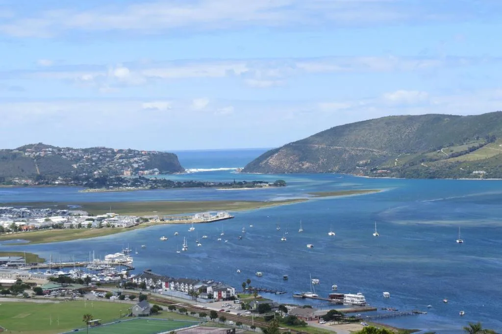 Panoramic aerial view of Knysna Heads with moored sailboats and lagoon