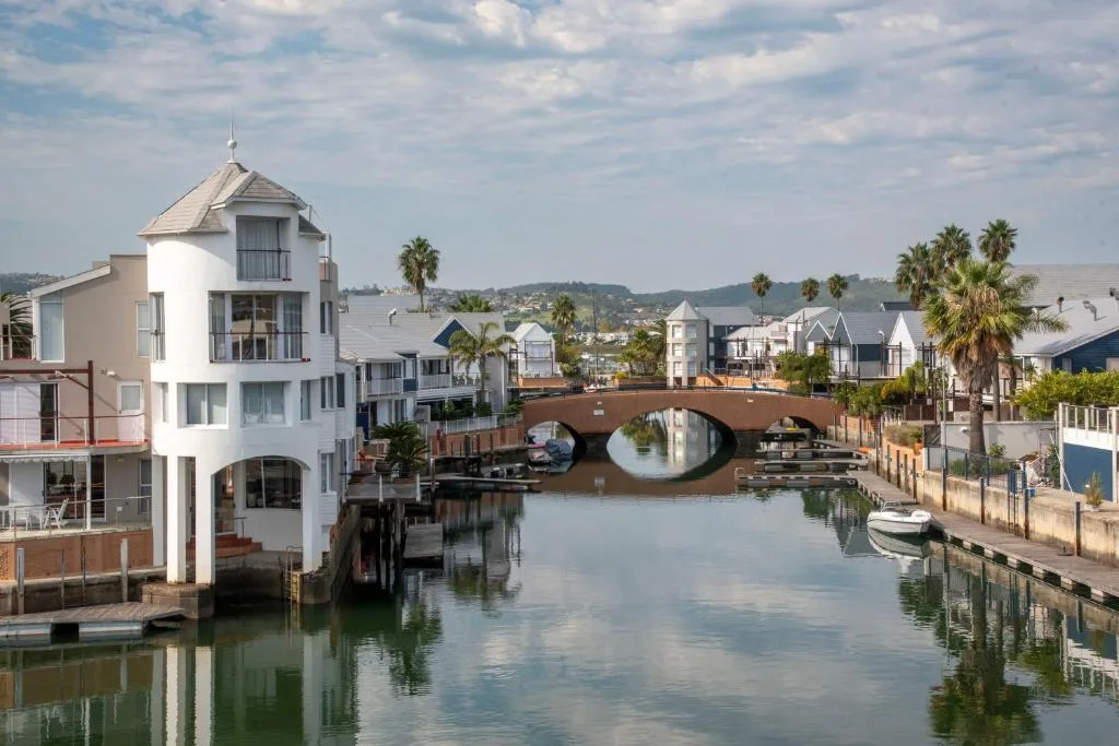 Waterfront property overlooking Knysna lagoon with bridge and boats