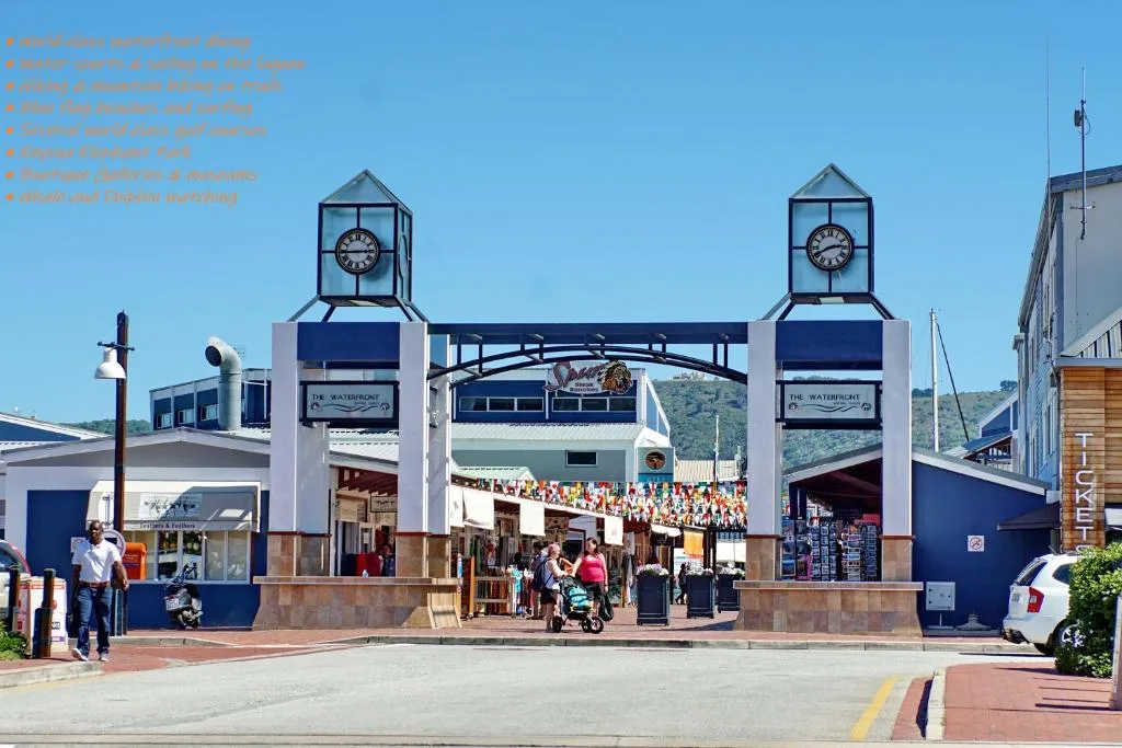 Knysna waterfront area with distinctive clock towers and scenic mountains