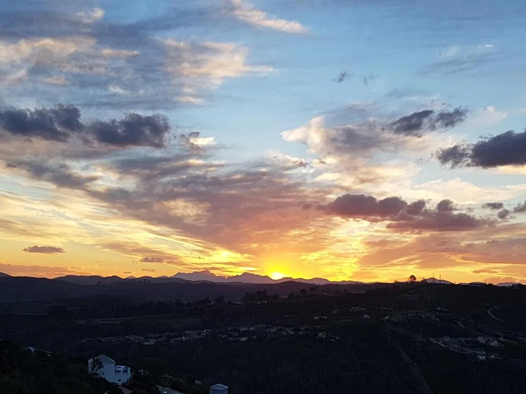 Dramatic sunset over Knysna mountains and valley landscape