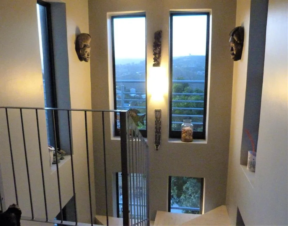 Scenic lagoon and mountain views through large windows from interior