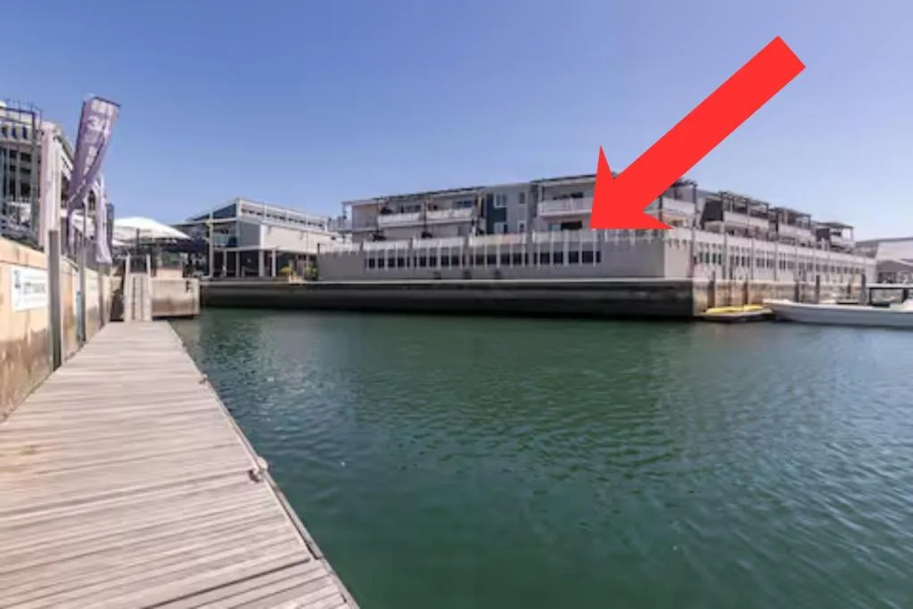 Waterfront apartment building overlooking calm lagoon waters in Knysna