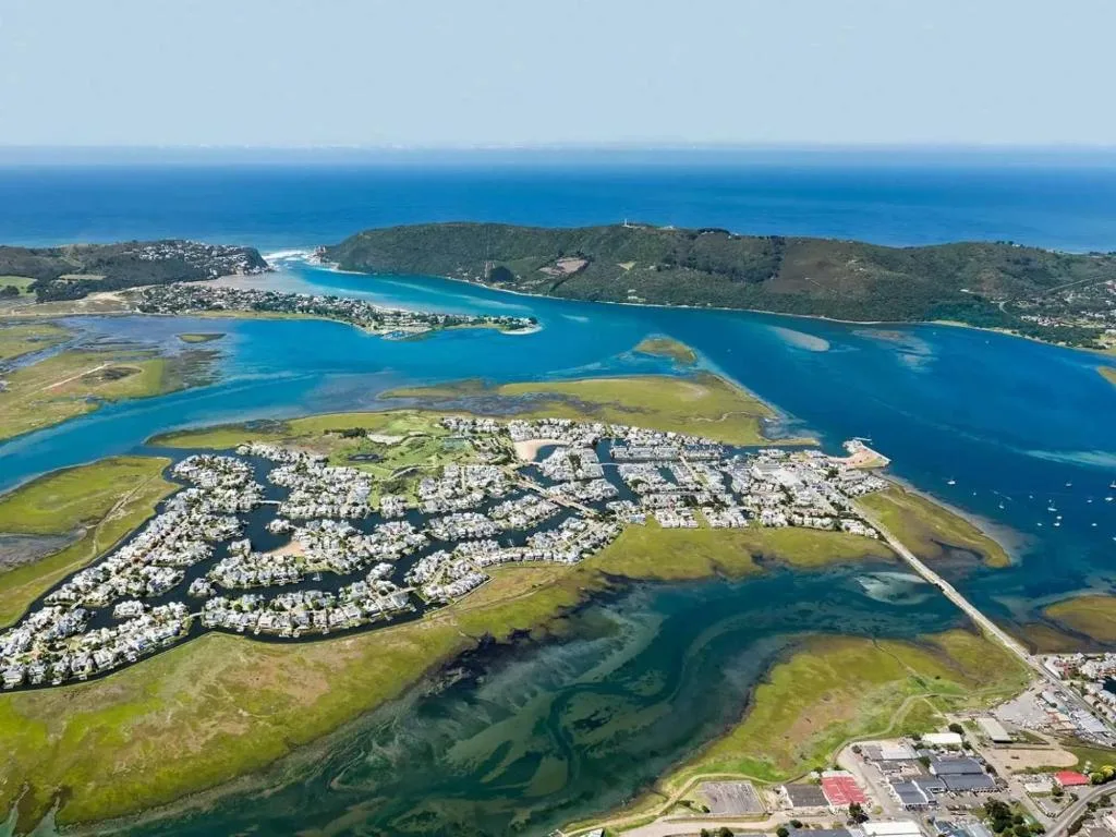 Aerial view of Knysna Heads lagoon with turquoise water and green hills