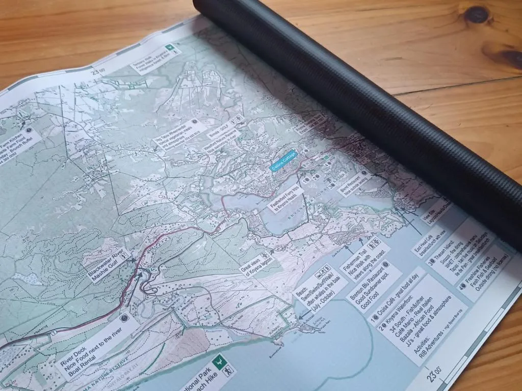 Topographical map of Garden Route region laid on wooden floor