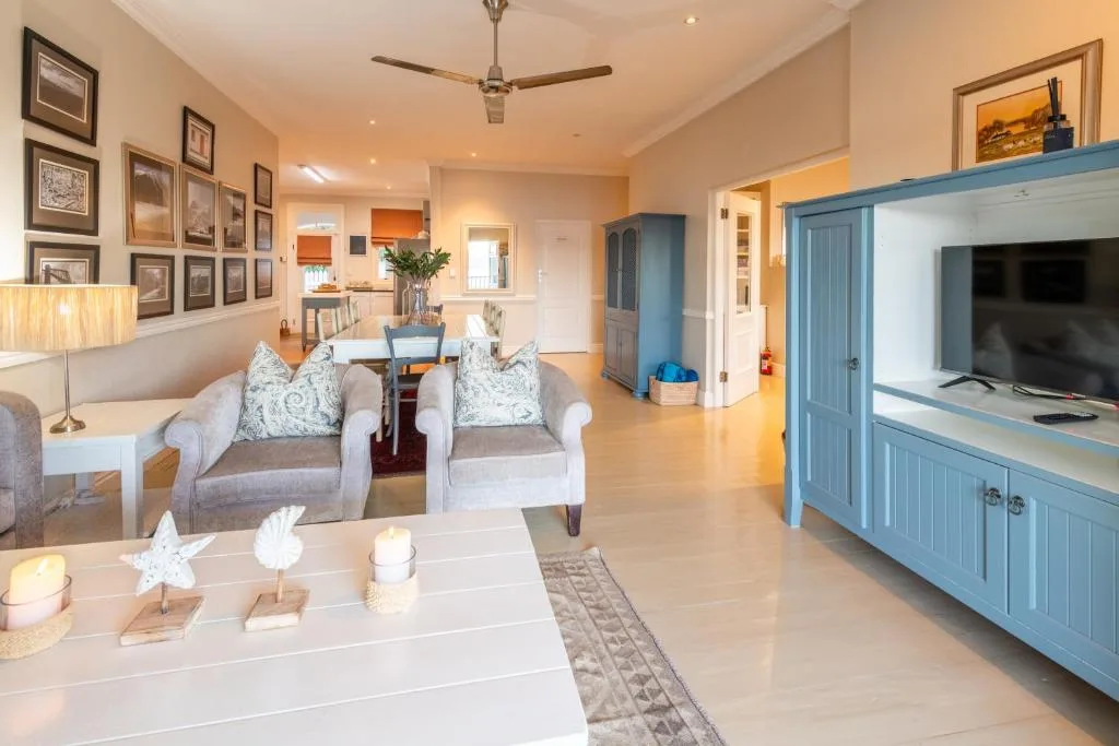 Spacious living room with comfortable seating and entertainment center