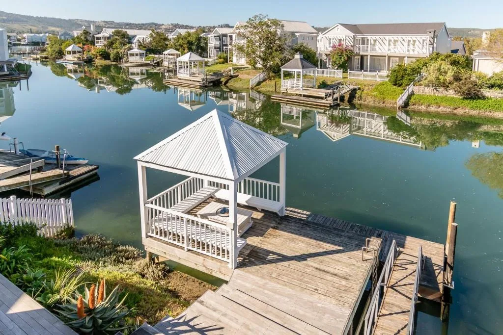 Waterfront gazebo with canal views and neighboring homes across the water
