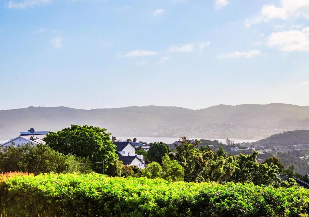 Mountain landscape and valley vista from property with lush garden in foreground