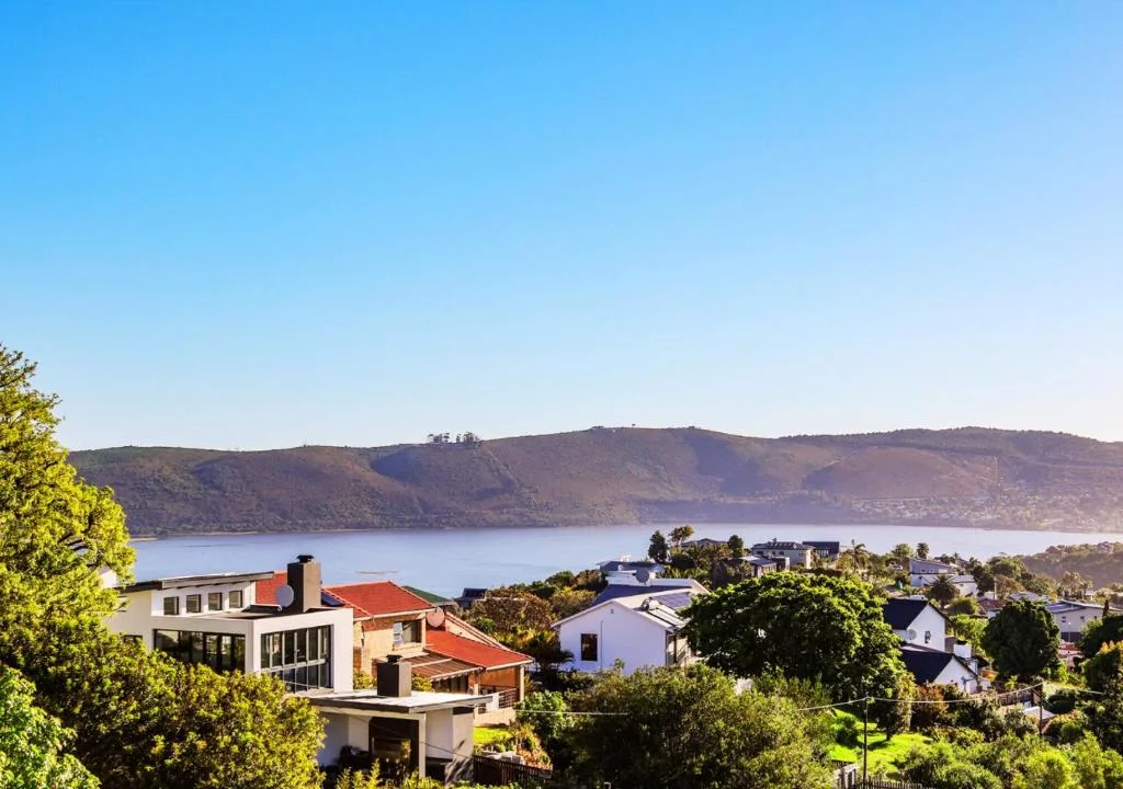 Scenic Knysna Lagoon and hillside village landscape with clear blue sky