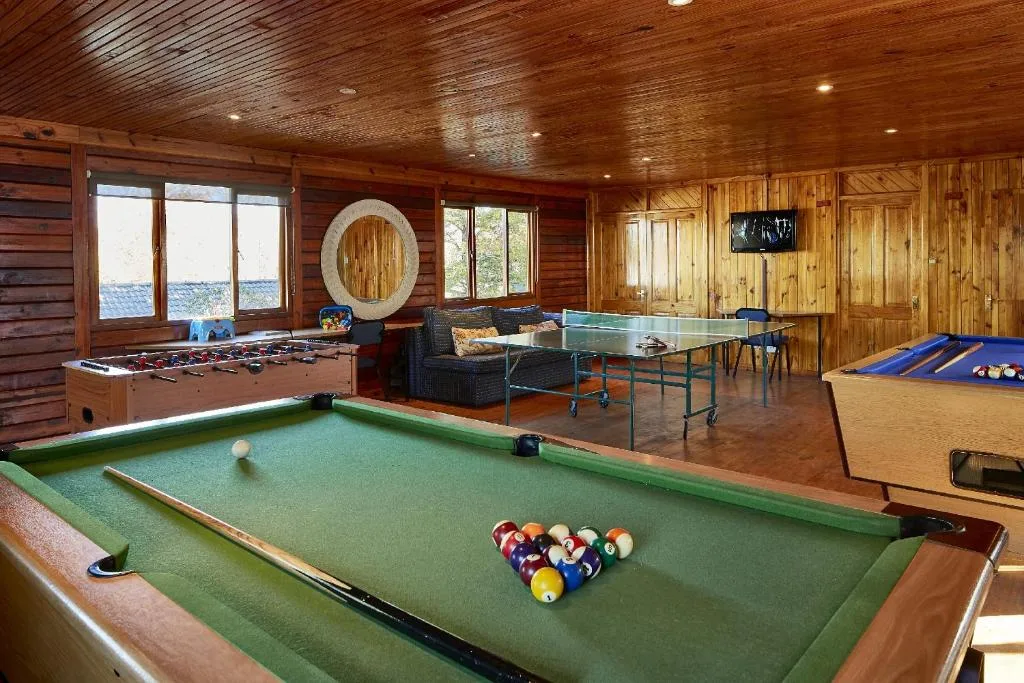 Games room with pool table, foosball, ping pong, and waterfront views