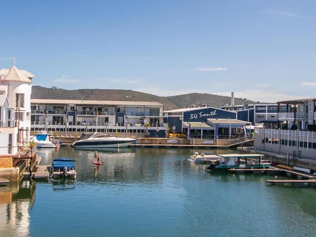 Waterfront view of Knysna Quays with boats and lagoon