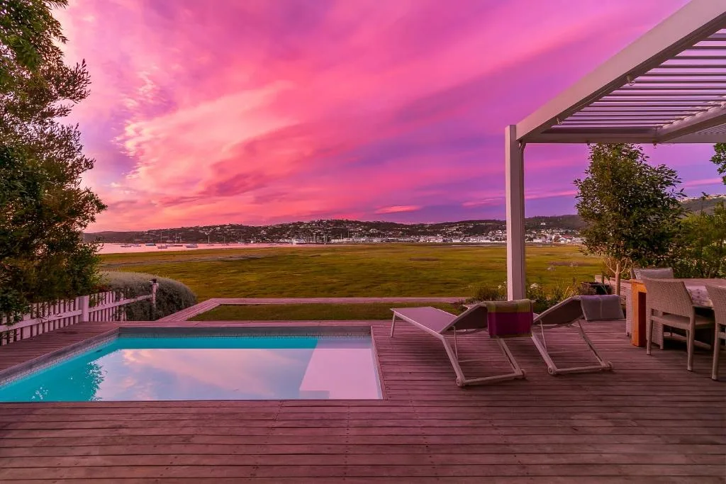 Swimming pool and deck with sunset view over Knysna Lagoon