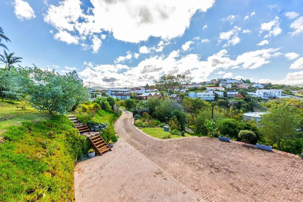 Scenic lagoon and town views with lush gardens and brick driveway