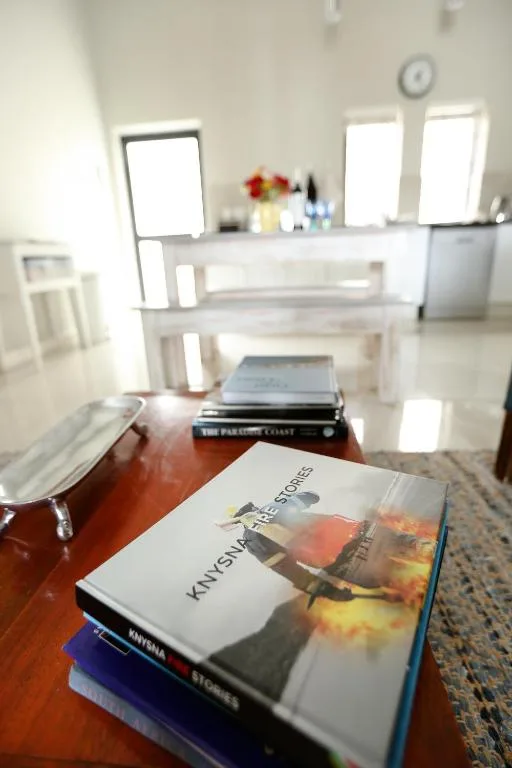 Coffee table with books and magazines in bright, modern interior space
