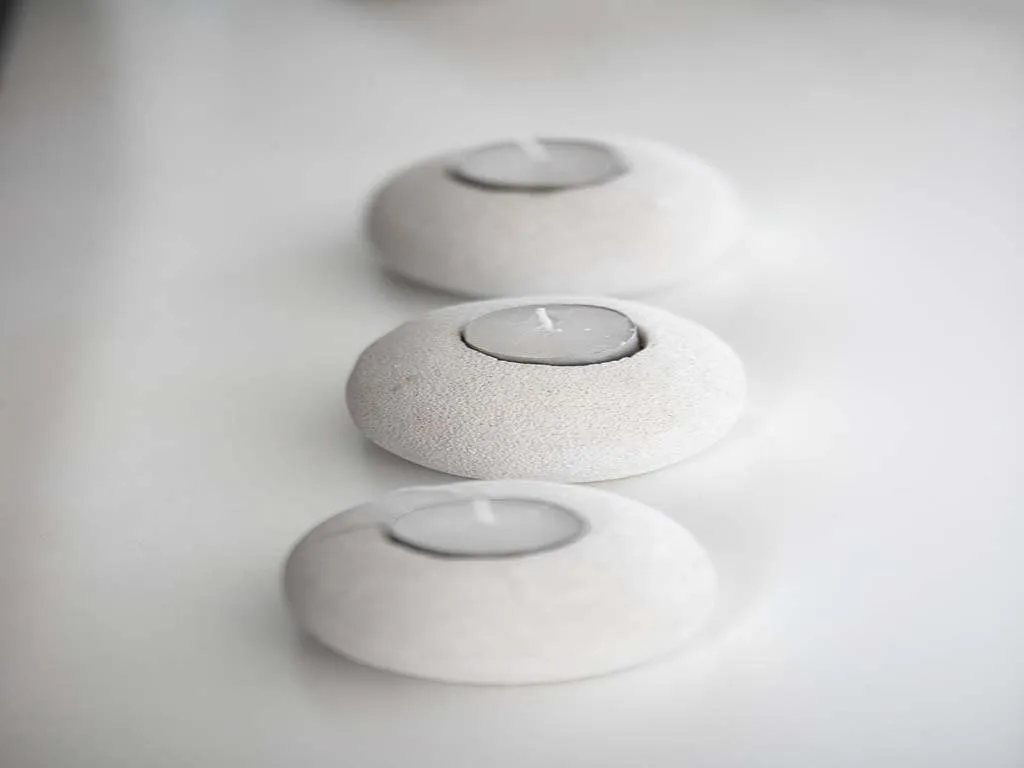 Three white smoke detectors mounted on ceiling for safety