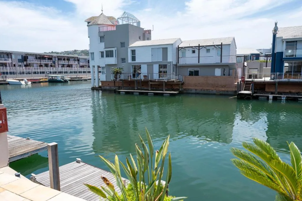 Waterfront property with distinctive tower overlooking calm lagoon waters