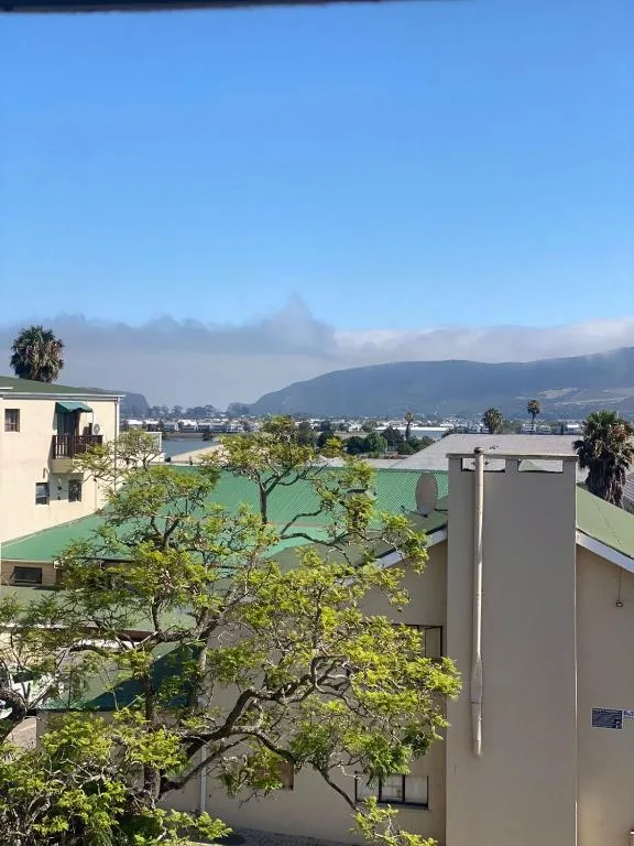 Scenic lagoon and mountain vista from the property with lush vegetation