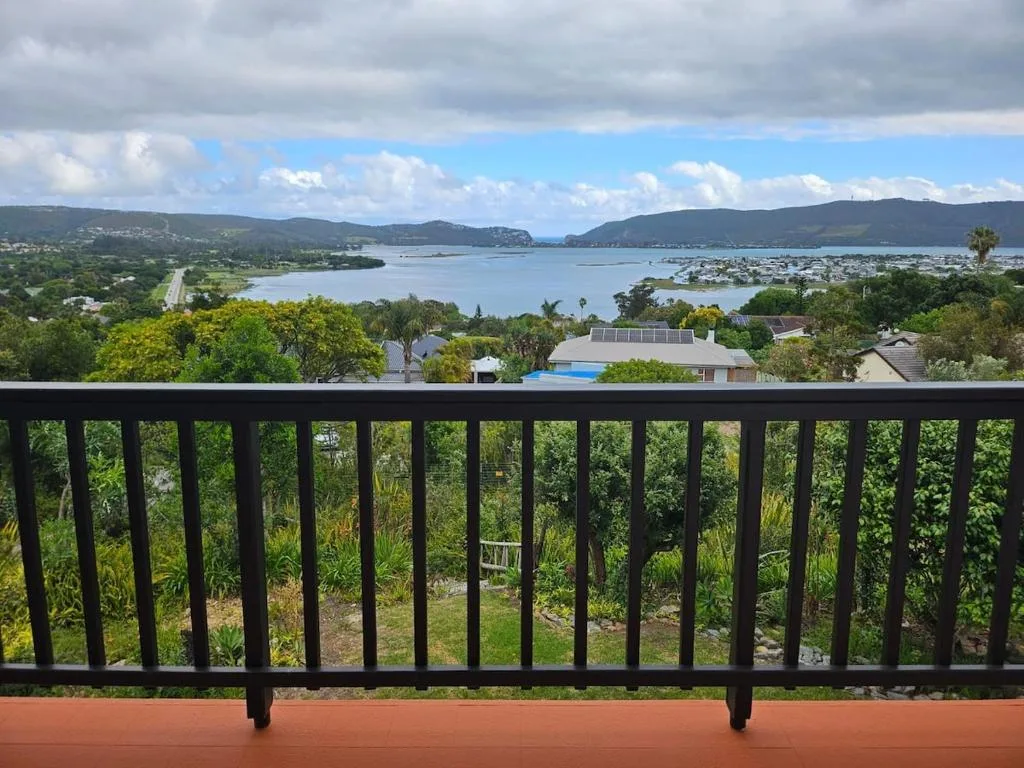 Scenic lagoon and mountain vista from elevated deck railing