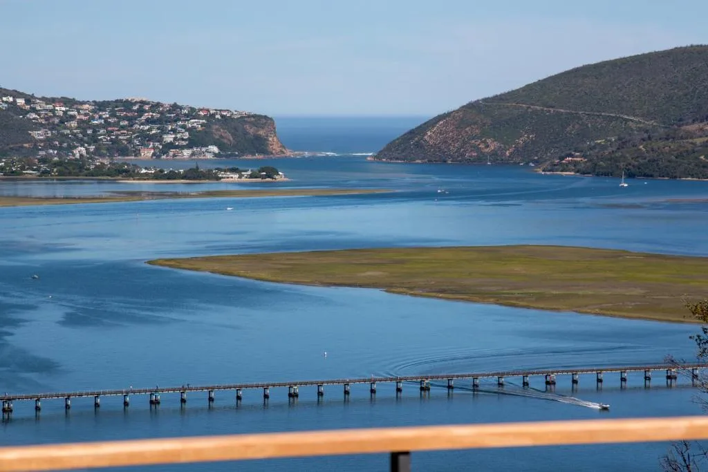 Scenic Knysna Heads lagoon view with sandy spit and forested cliffs