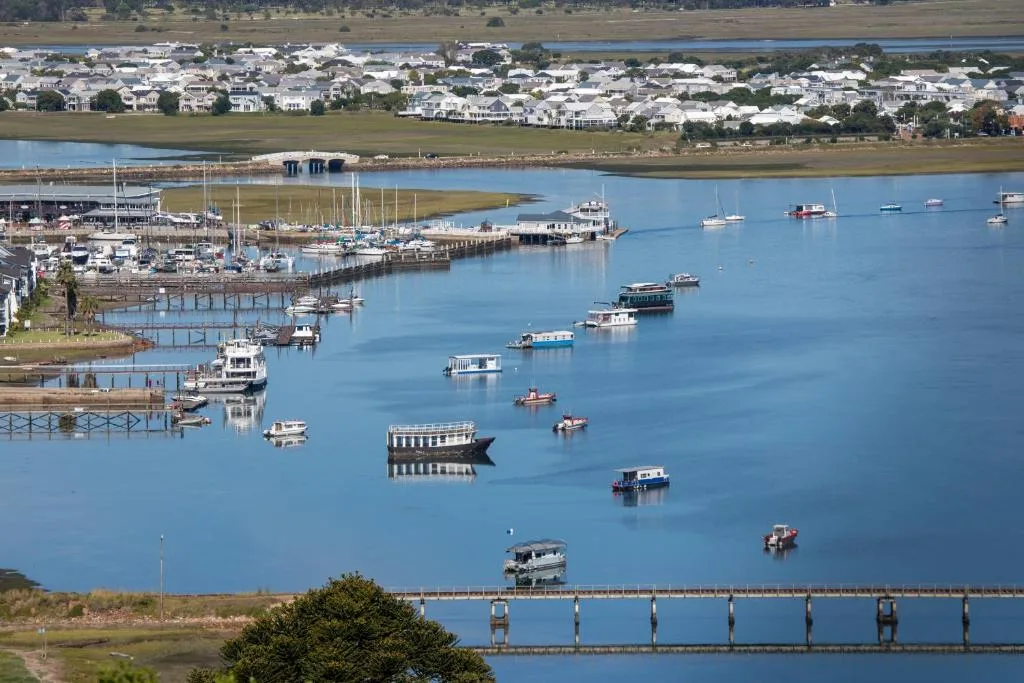 Aerial view of Knysna Heads with moored boats and waterfront town