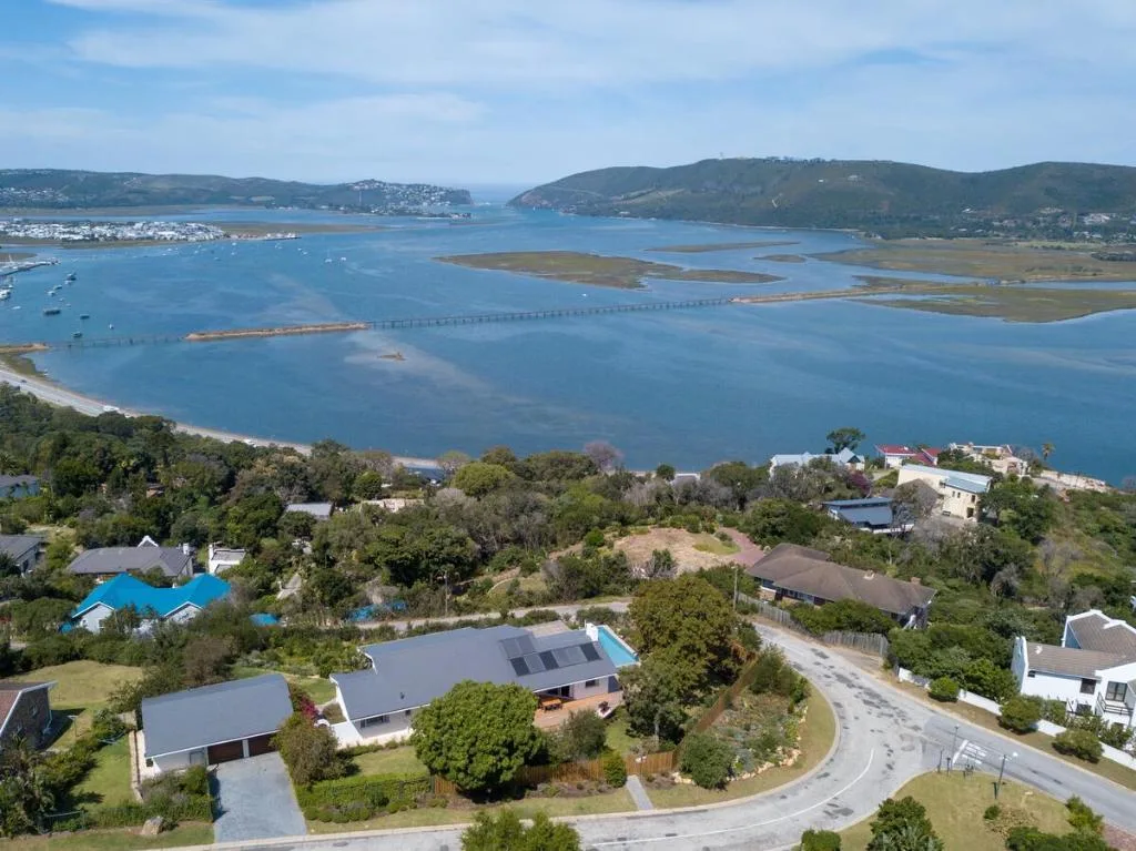 Aerial view of Knysna lagoon with surrounding hills and waterfront properties