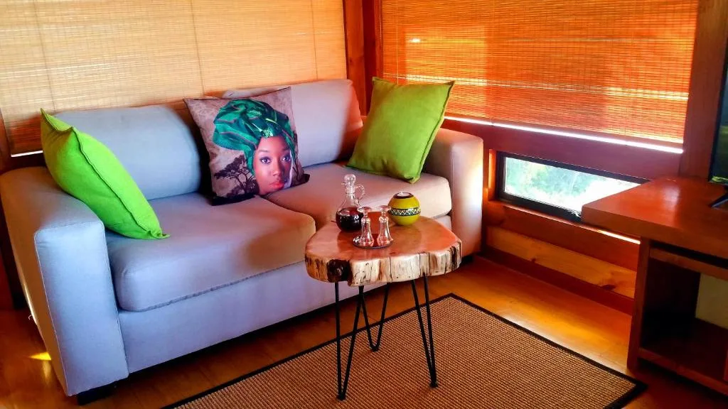 Modern lounge with lavender sofa, vibrant green cushions, wooden side table