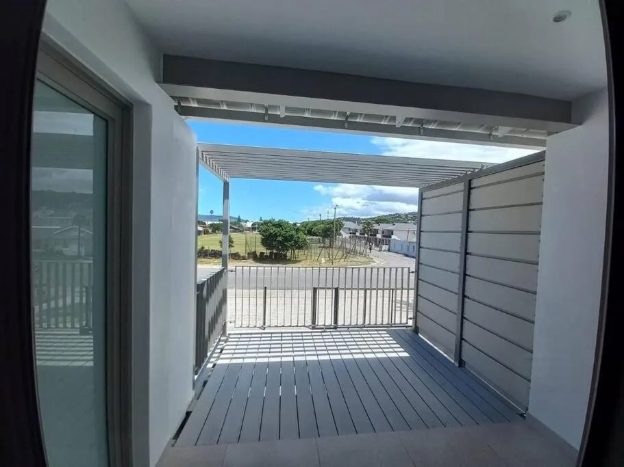 Modern covered deck with composite boards and countryside views
