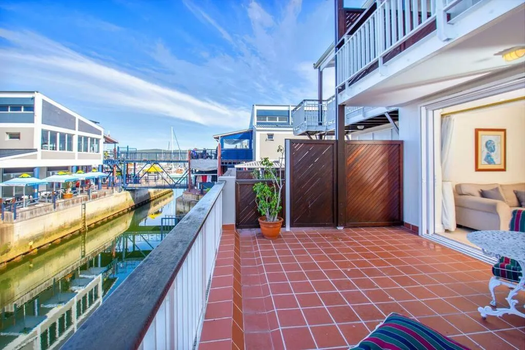 Spacious waterfront patio with terracotta tiles overlooking Knysna lagoon