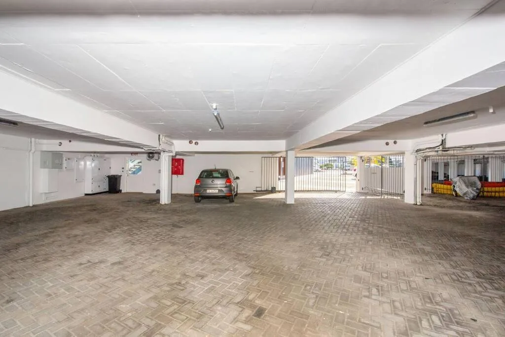Spacious covered parking garage with vehicle and storage facilities