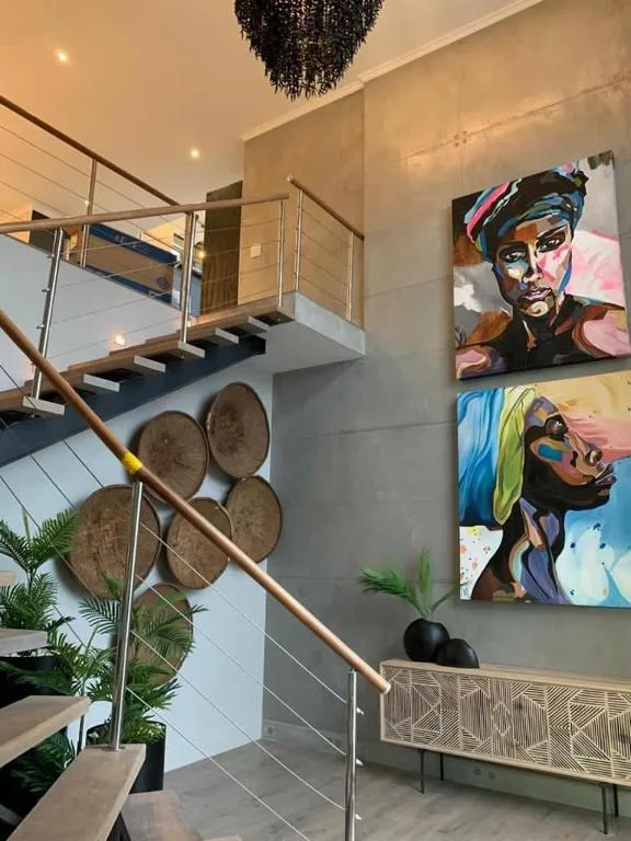 Modern staircase with contemporary art and woven baskets decoration