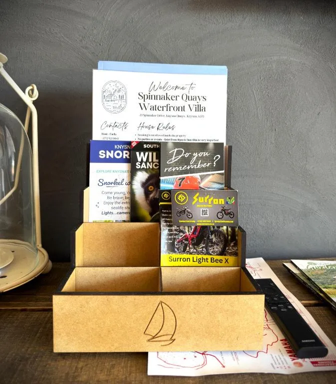 Welcome booklet and local guides in decorative wooden box display