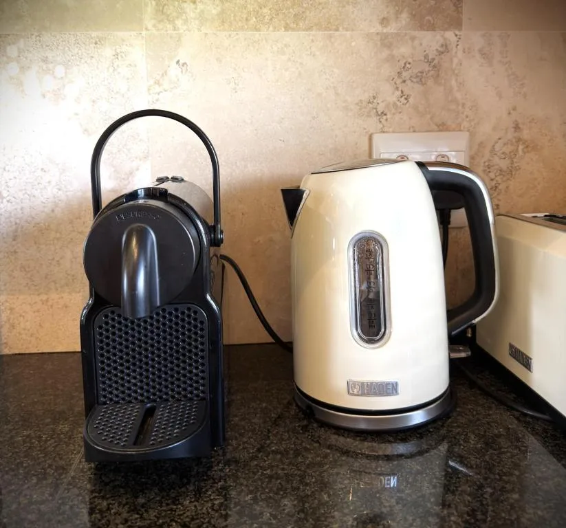 Kitchen counter with coffee maker and espresso machine appliances