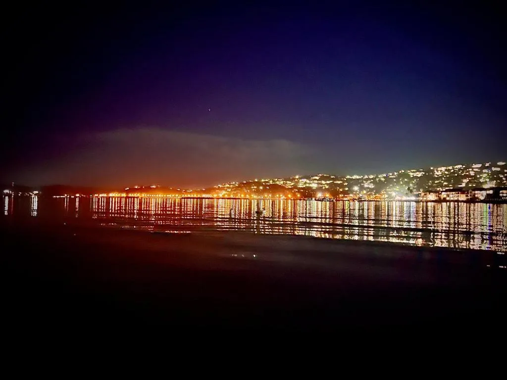 Night view of Knysna Heads and town lights reflecting on water