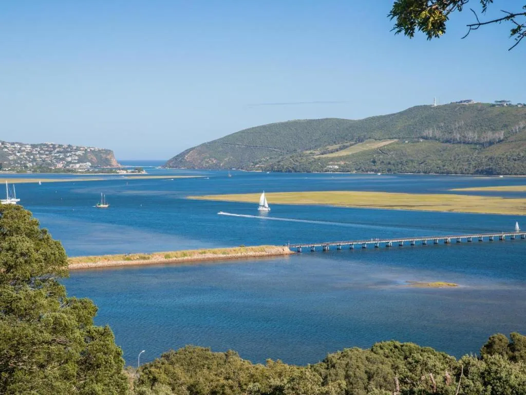 Panoramic view of Knysna Heads with sailboats and green mountains