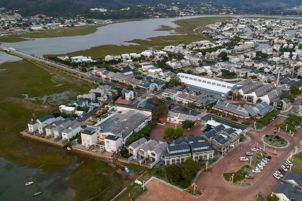 Aerial view of Thesen Islands development with lagoon and mountains beyond