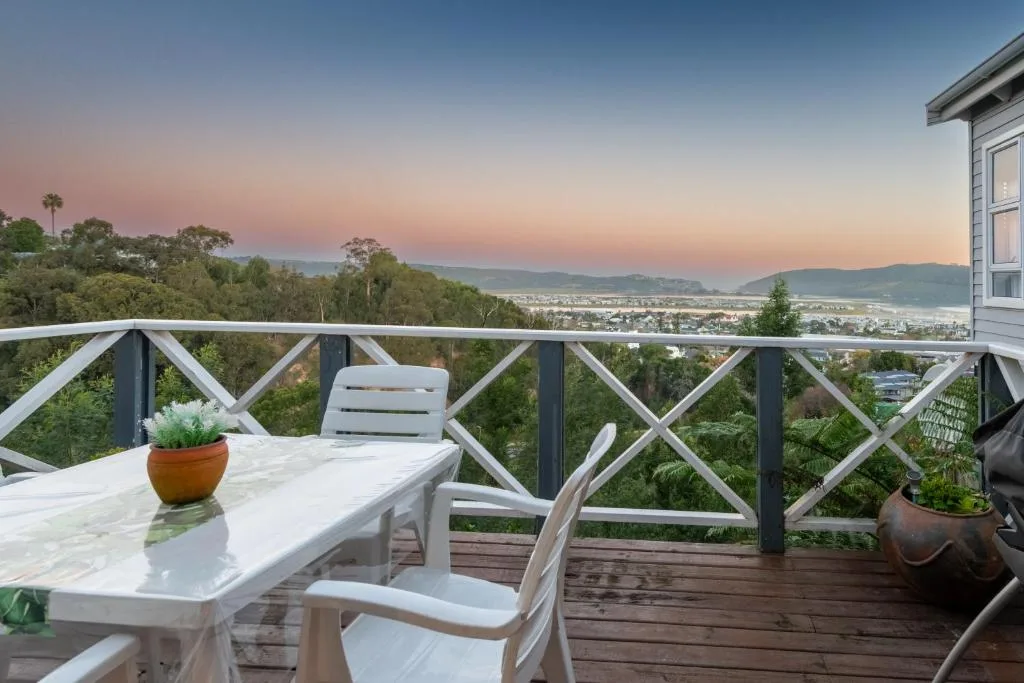 Lagoon and mountain views at sunset from elevated deck