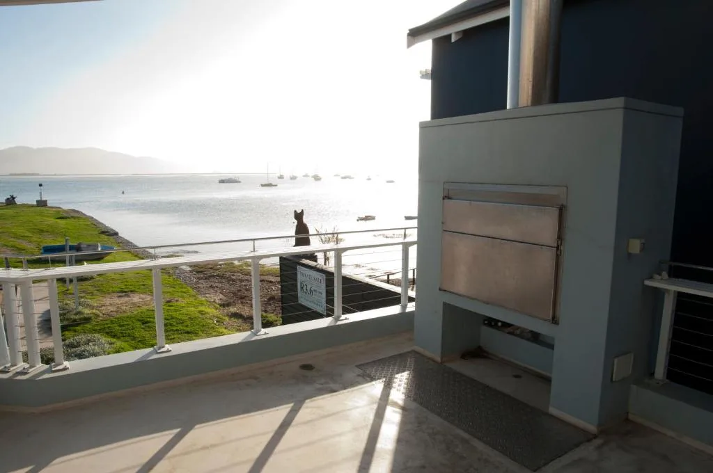 Waterfront deck with braai and panoramic lagoon views