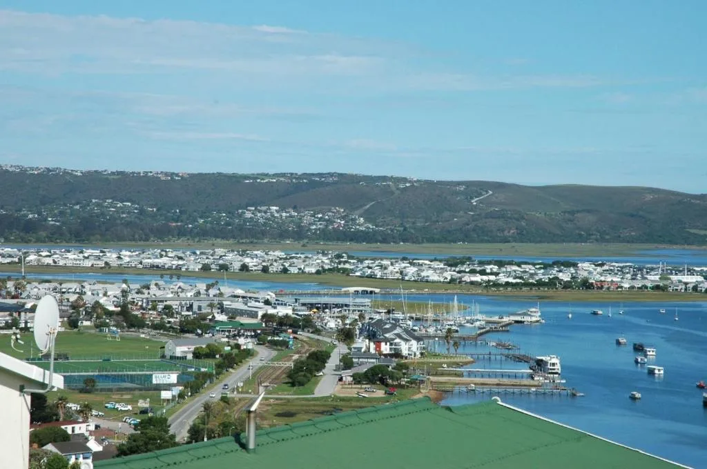 Panoramic view of Knysna Heads, harbor, and lagoon with green hills beyond