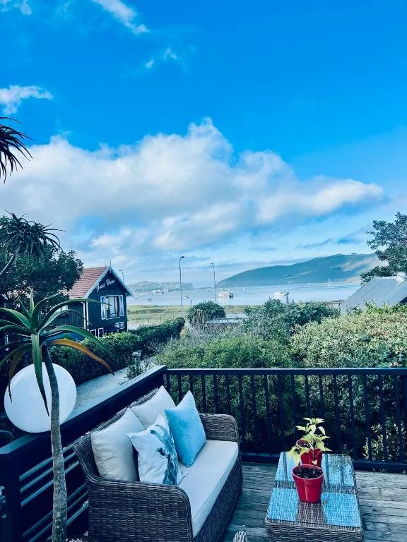 Scenic lagoon and mountain vista from beachfront property deck