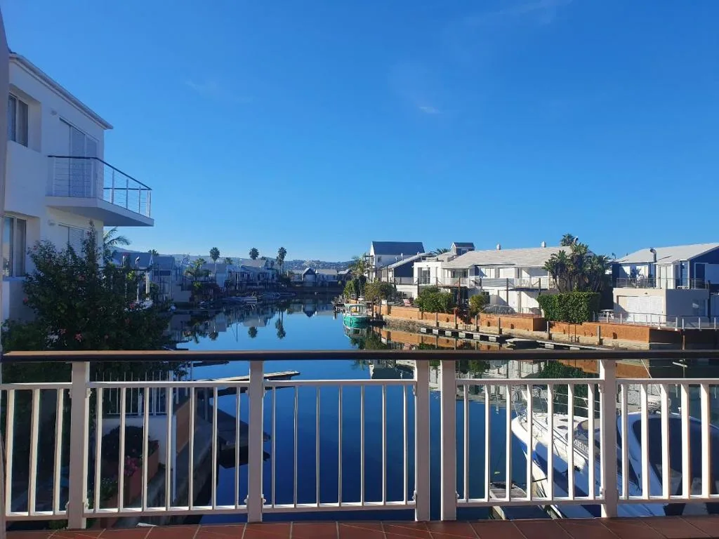Scenic waterfront view of Knysna Quays canal and surrounding properties