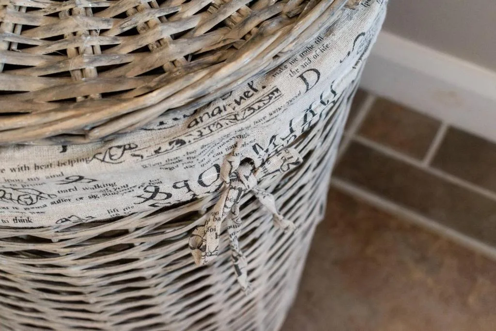 Close-up of woven basket with newspaper lining and rustic string tie
